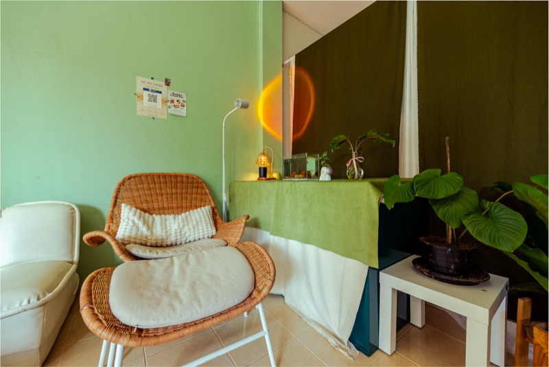 Wicker chair and plant corner at Petrichor Massage
